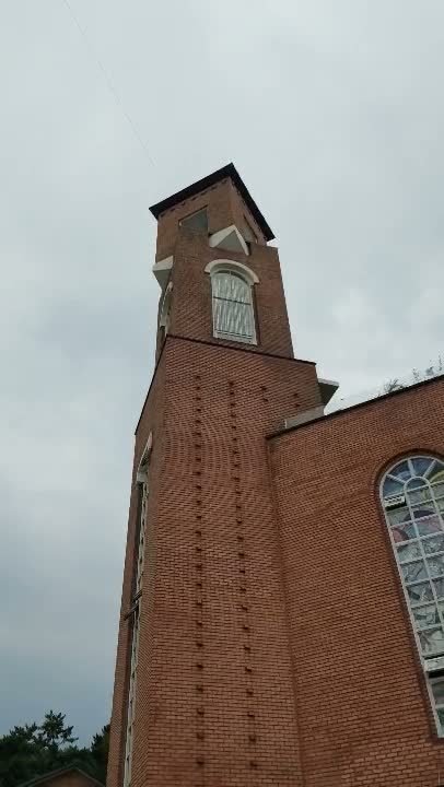 The red brick bell tower at Made Lim